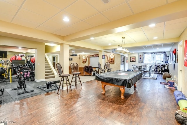 rec room with a drop ceiling, wood-type flooring, and pool table