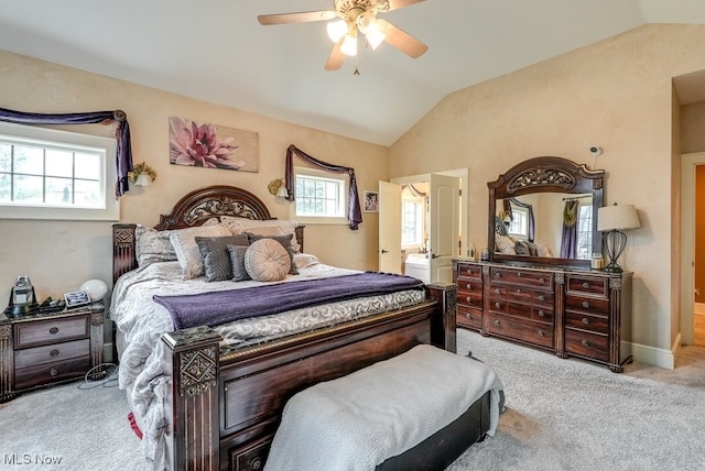 bedroom featuring ceiling fan, light colored carpet, lofted ceiling, and multiple windows