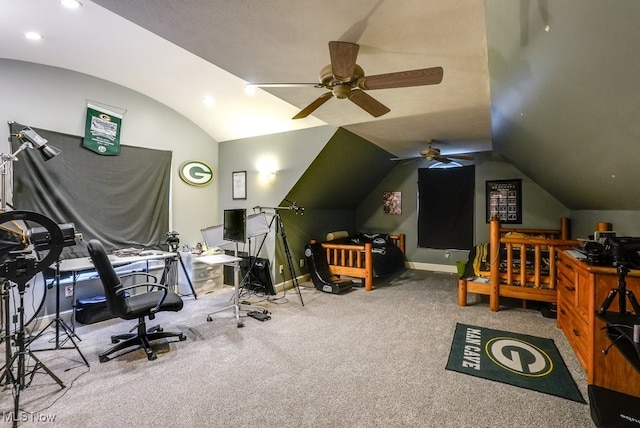 interior space with ceiling fan, carpet floors, and vaulted ceiling