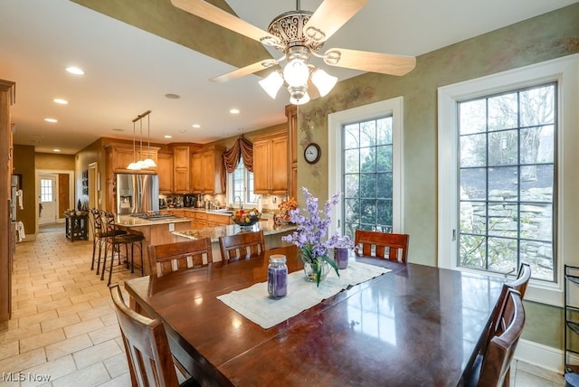 dining area with ceiling fan