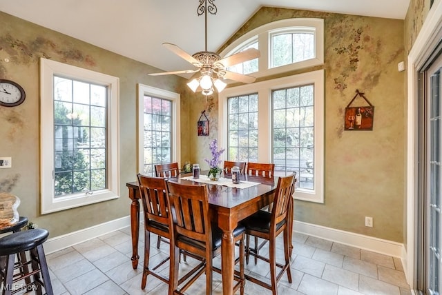 dining area featuring ceiling fan and vaulted ceiling