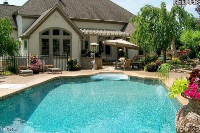 view of pool featuring a patio area