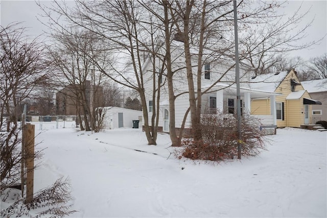 view of yard layered in snow