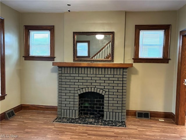 room details featuring wood-type flooring and a fireplace