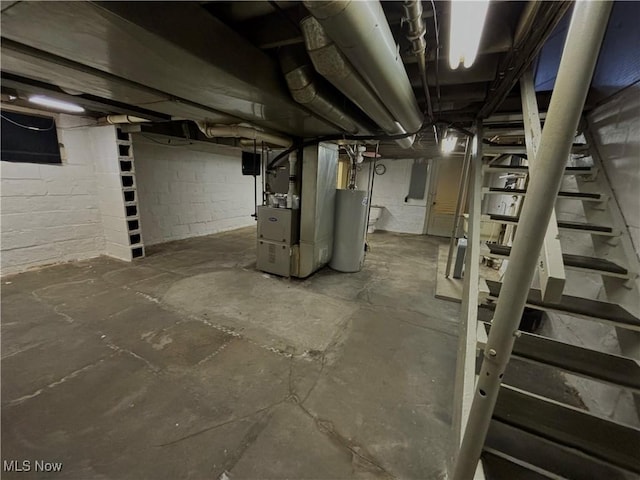 basement featuring water heater and heating unit