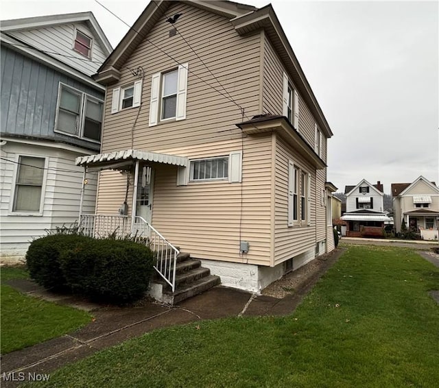 exterior space with a front lawn