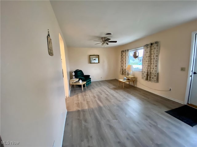 unfurnished room featuring ceiling fan and hardwood / wood-style flooring