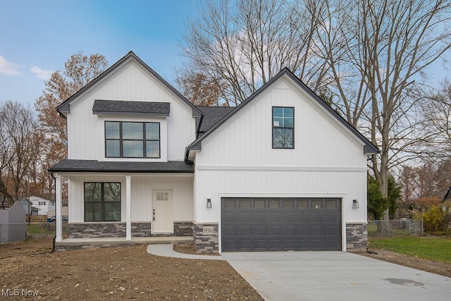 modern farmhouse style home featuring a garage