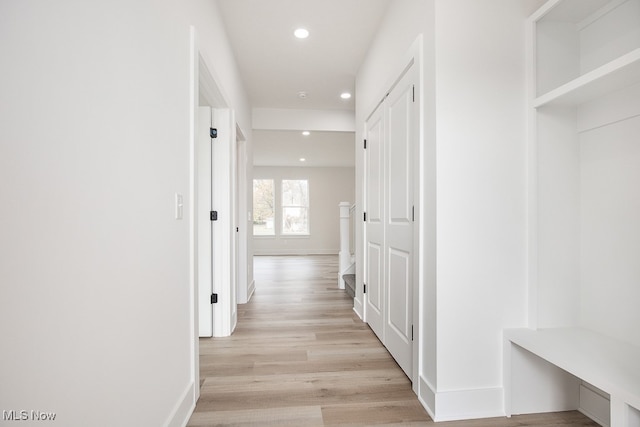 corridor featuring light hardwood / wood-style floors