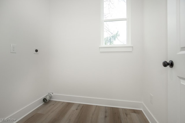 laundry area featuring hardwood / wood-style flooring and hookup for an electric dryer