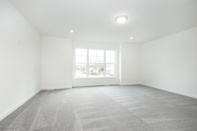 spare room featuring carpet