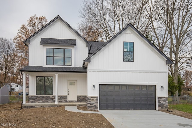 modern farmhouse style home featuring a garage