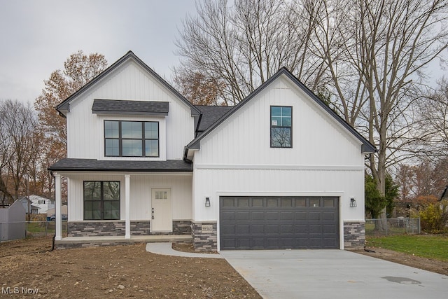 modern farmhouse style home featuring a garage