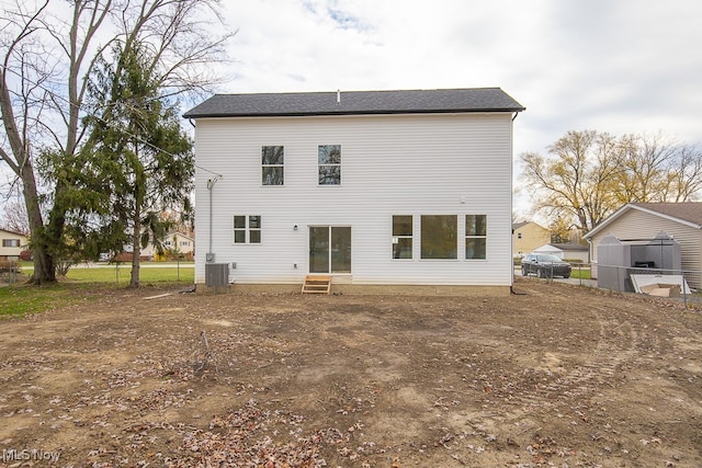 rear view of property featuring central air condition unit