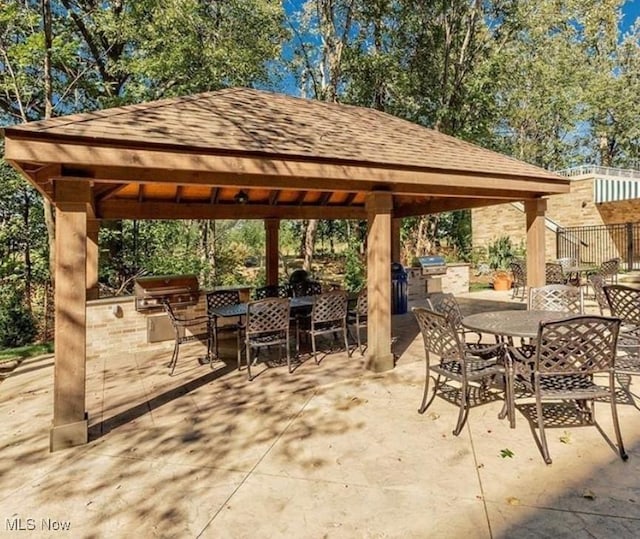 view of patio / terrace featuring a gazebo, area for grilling, and grilling area