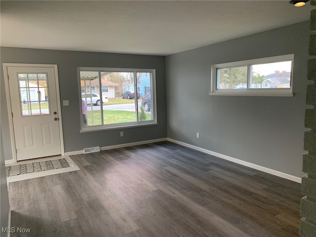 entryway with dark wood-type flooring