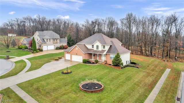 view of front of property with a garage and a front yard