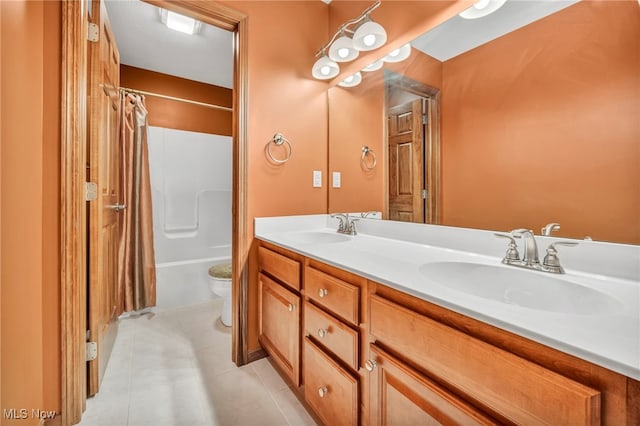 full bathroom featuring tile patterned floors, shower / bath combination with curtain, toilet, and vanity