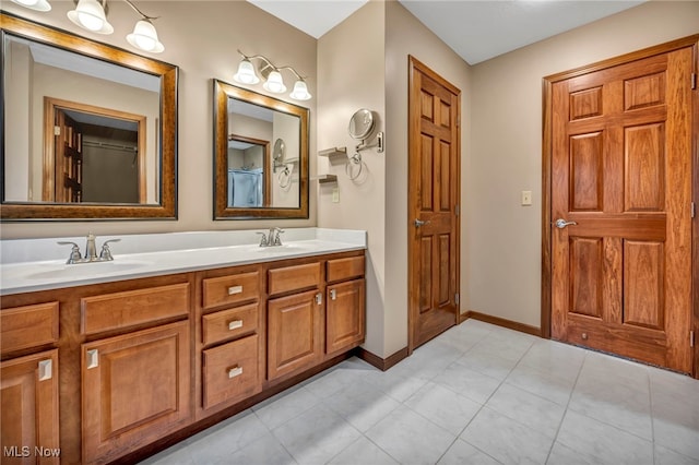 bathroom with tile patterned flooring and vanity