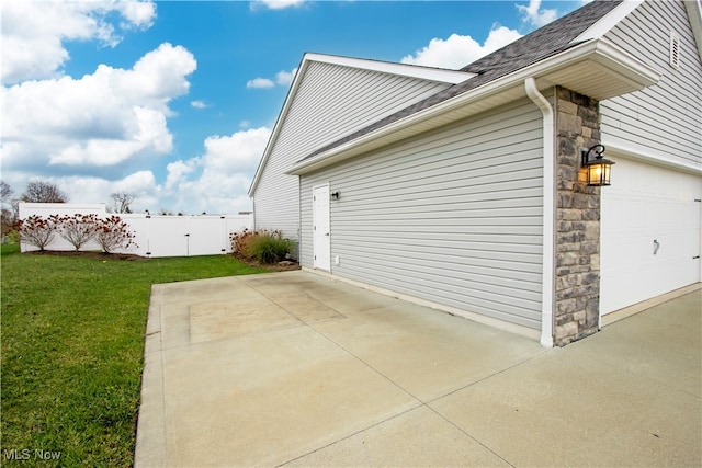 view of side of property featuring a yard