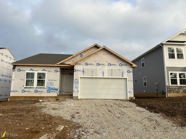 unfinished property with a garage