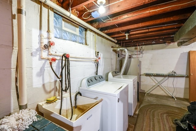 laundry area with sink and independent washer and dryer