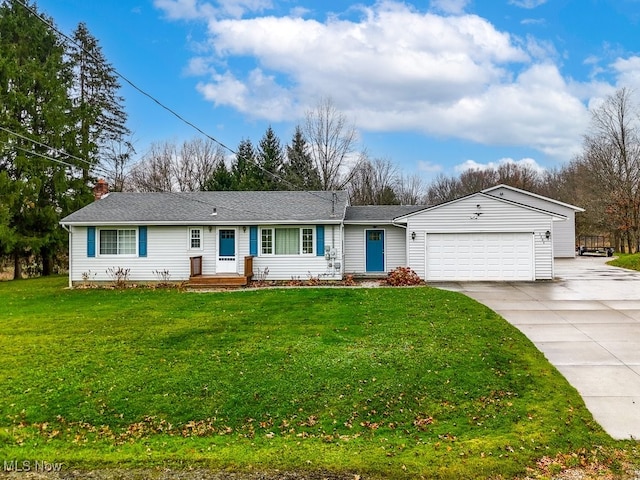 single story home with a garage and a front lawn