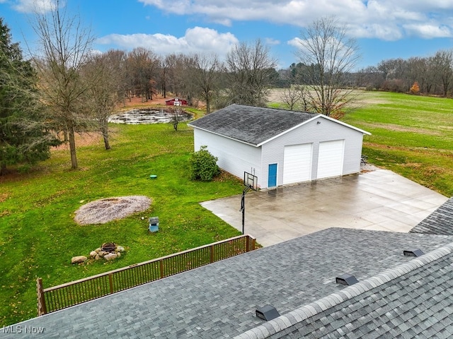 exterior space featuring a yard and an outdoor structure