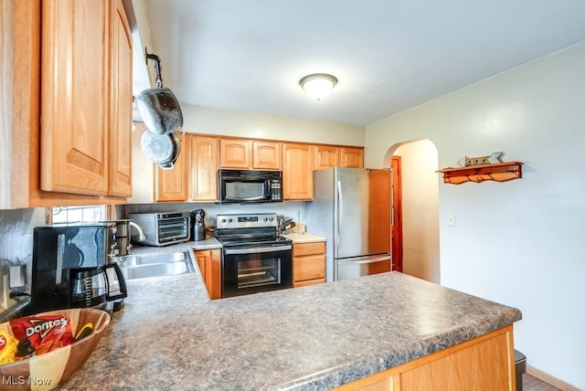 kitchen with sink and black appliances