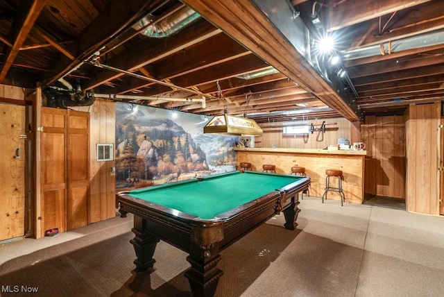 game room with wooden walls and pool table