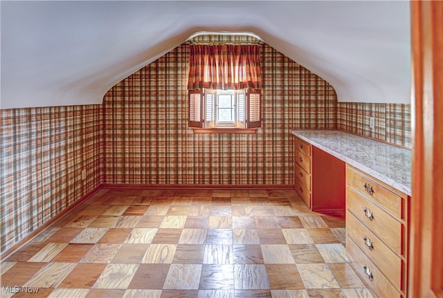 bonus room with vaulted ceiling