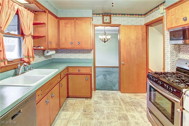 kitchen with pendant lighting, a chandelier, sink, and stainless steel appliances