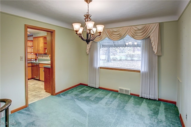 unfurnished room featuring light carpet and a notable chandelier