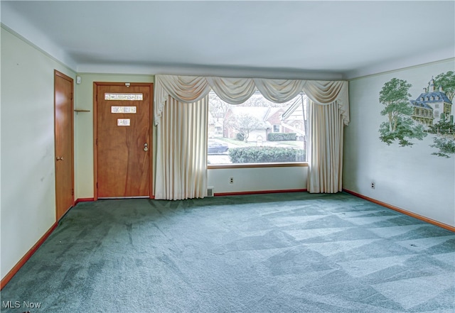 view of carpeted foyer