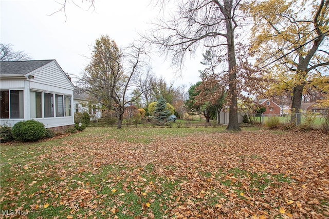 view of yard featuring a sunroom