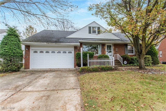 view of front facade with a front yard and a garage