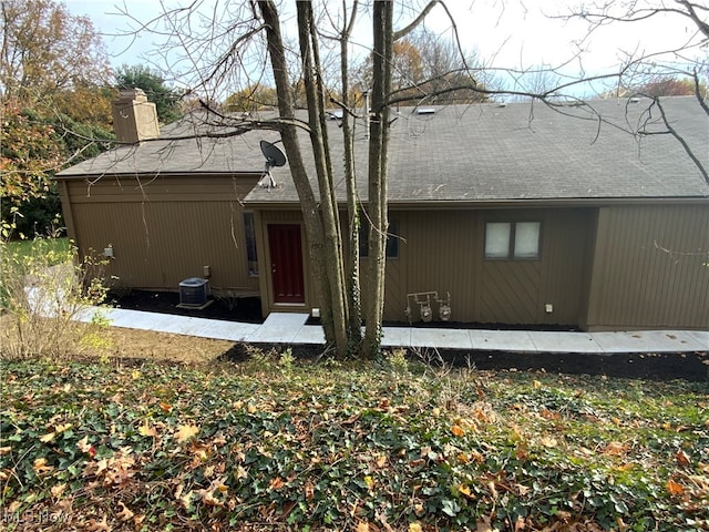 rear view of house with cooling unit