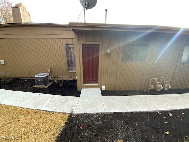 entrance to property featuring central AC unit