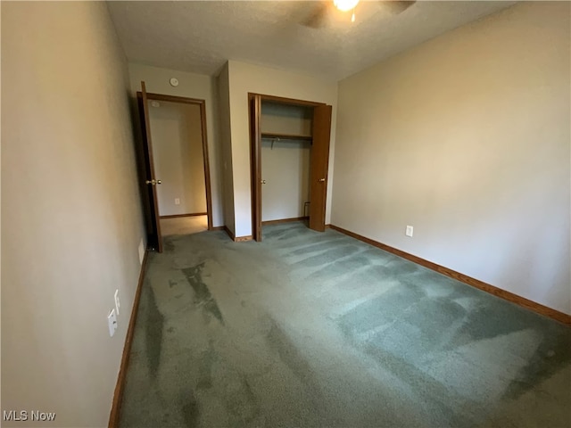 unfurnished bedroom featuring carpet, ceiling fan, and a closet