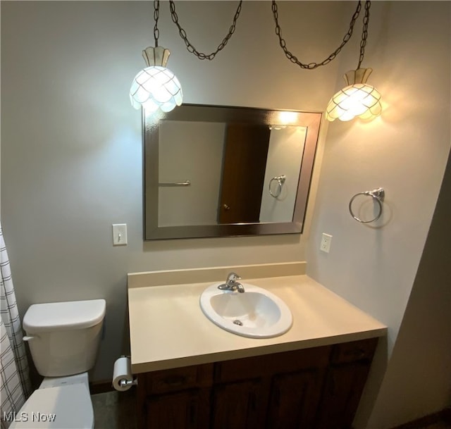 bathroom featuring vanity and toilet