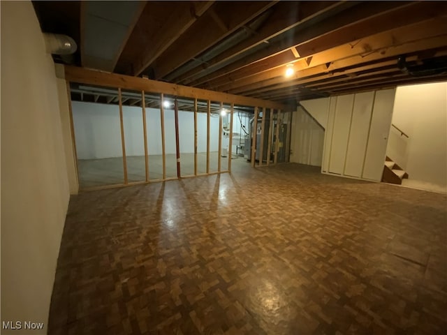 basement featuring parquet floors