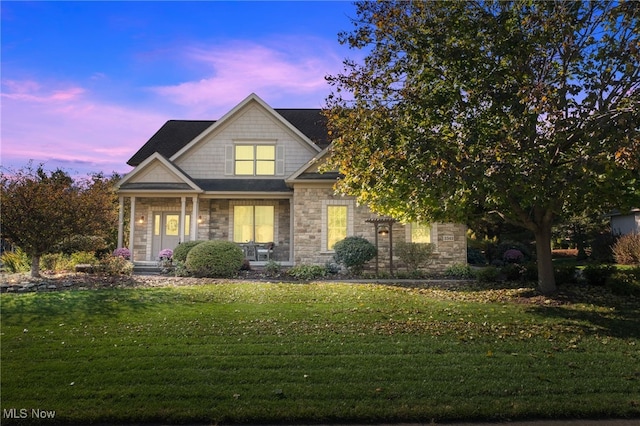 view of front of property with a yard