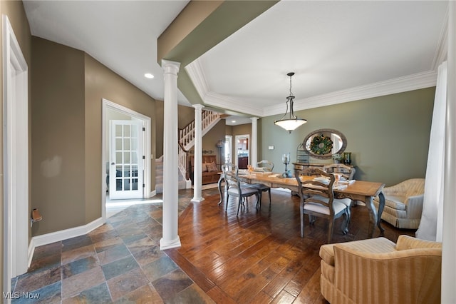 dining area with dark hardwood / wood-style flooring, decorative columns, and ornamental molding