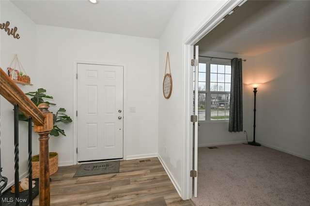 view of carpeted foyer