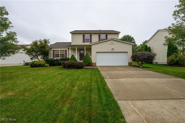 front of property with a front yard and a garage