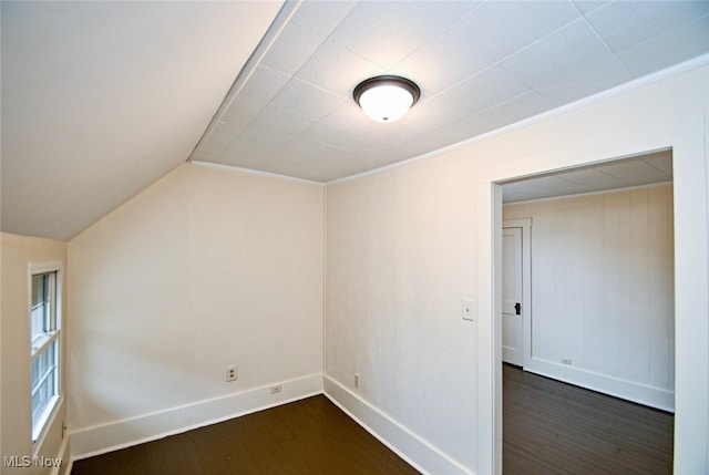 bonus room featuring vaulted ceiling and dark hardwood / wood-style floors