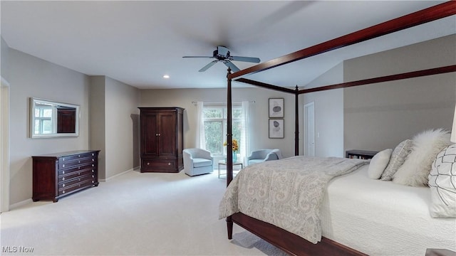 carpeted bedroom with ceiling fan and lofted ceiling