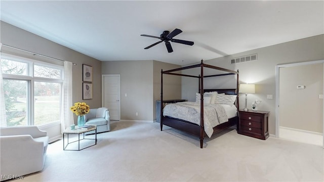 bedroom with ceiling fan and light carpet