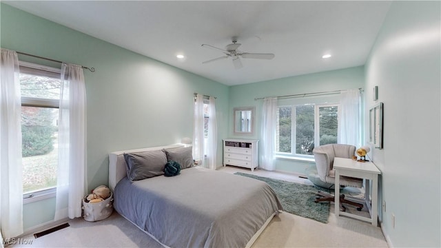 carpeted bedroom with ceiling fan