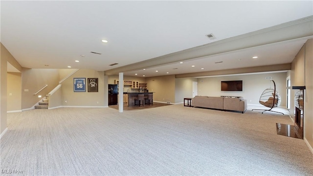 unfurnished living room with light carpet and crown molding